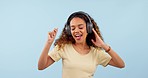 Headphones, dance and young woman in a studio listening to music, radio or playlist for fun. Happy, smile and young female person from Colombia streaming a song or album isolated by white background.