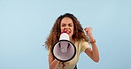 African woman, megaphone and protest, speech and angry in politics, justice and vote for change on blue background. Face of young leader with voice, call to action and attention or warning in studio