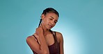 Fitness injury, studio woman or neck pain from workout problem, mistake or challenge fatigue, tired or burnout risk. Person massage muscle fail, strain or competition accident on blue background