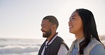 Happy couple, walking and beach at sunset for vacation, holiday fun or travel. Asian woman and man together at ocean with interracial love, romance and adventure outdoor to relax and talk by water