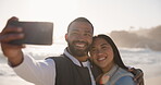 Couple, selfie and happy at beach for vacation, holiday fun or travel with social media. Asian woman and man together at ocean with interracial love, profile picture and adventure memory outdoor