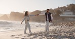 Freedom, dance and couple at a beach for travel celebration, happy and fun in nature. Love, ocean and man with woman at the sea dancing, smile and bond on excited about traveling trip in Puerto Rico