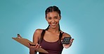 Woman, machine and smile in studio for payment, gym subscription and checklist by blue background. Personal trainer, coach and pos with clipboard, documents and sale for membership, workout or health