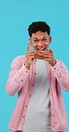 Happy, face and man in studio with hand pointing for you, celebration and choice on blue background. Excited, portrait and male model with emoji finger for opportunity, offer or decision, vote or hey