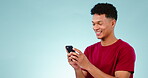 Phone, man and comic face in studio for funny chat, social media, meme or conversation on blue background. Smartphone, person and laughing at internet gif, website search or online post with mockup