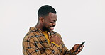 Goal, phone or black man excited by notification in studio winning a competition on white background. Yes, winner or happy African guy reading message, news or chat for score results for game online