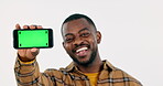 Face, man and advertising green screen of phone, space or sign up offer in studio on white background. Happy african model, portrait and tracking markers on mobile for news, mockup promotion and deal