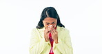 Sick, woman and blowing nose in studio for cold, allergies and risk of medical virus on white background. Asian model, tissue and sneeze for sinusitis, allergy and bacteria of winter flu infection
