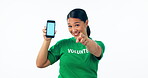 Woman, volunteering and phone blue screen, presentation mockup and support, join us or marketing in studio. Face of young asian student on mobile app, pointing you or information on white background