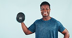 Fitness, man and dumbbell in studio for training, exercise or workout with happiness on blue background. Weightlifting, person and personal trainer for wellness and healthy body with smile at gym