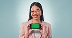 Happy, news and green screen phone by woman in studio with sign up, deal or wow offer on blue background, Smartphone, presentation and portrait of female model with service, support or app promotion 