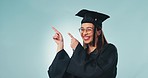 Face, graduation and woman with celebration, pointing and achievement on a blue studio background. Portrait, person and model with hand gesture, education and announcement with future and success