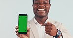 Businessman, hand and pointing to phone with green screen, mockup and mobile app for communication. Contact us, black man and portrait with gesture or promotion for tech, chroma key or social media 