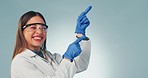 Woman, hands and happy scientist pointing in studio background with promotion or presentation of information. Science, portrait and person show mockup with advice, review or menu option in laboratory