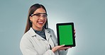 Science woman, tablet and green screen in studio with ux, face and review medical app by blue background. Doctor, digital touchscreen and mockup space with tracking markers, feedback and research