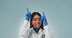 Woman, safety glasses and gloves, researcher and blue studio background, excited and choice for advertisement, smile and pointing. Happiness, positive and mockup for marketing, ideas and information