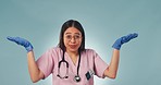 Portrait, studio and woman doctor pointing at choice for care, wellness or opinion for health insurance. Medical professional in presentation on guide, information and vote  on blue background mockup