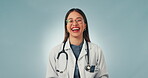 Face, woman and doctor with a smile, funny and career with success on a blue studio background. Portrait, person and medical professional with humor, laughing and confident worker with stethoscope