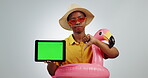 Tablet, thumbs down and sad woman on green screen in studio, tracking markers and isolated on a white background mockup space. Travel, dislike holiday and bad review of African person on technology