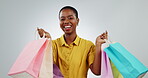 Black woman dancing with shopping bag, sale at market with retail and wealth isolated on white background. Happiness in portrait for discount, promotion and commercial savings with smile in studio