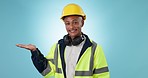 Construction worker, portrait and studio with open palm on blue background for marketing or planning. Black man, services and model as employee for building, project management and smile as mockup