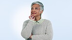 Mature woman, smile and thinking a question in studio by blue background. Happy mexican person, strategy and planning for decision, idea and brainstorming for retirement, problem solving and senior