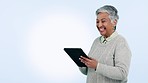 Tablet, comic and happy senior woman laugh in studio with social media, streaming or meme on blue background. Digital, news and elderly female with app sign up for funny chat, gif or communication