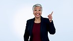 Choice, face and senior woman with hand pointing in studio for business, faq or solution on blue background. Decision, presentation and portrait of happy elderly lady ceo show checklist, menu or info