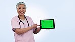 Nurse, tablet green screen and woman presentation, speaking of healthcare information or telehealth in studio. Face of medical doctor on digital app mockup, video tracking marker and blue background