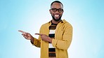 Pointing, wow and face of black man on blue background for promotion, advertising and choosing. Emoji, happy and portrait of person with hand gesture for option, agreement and decision in studio
