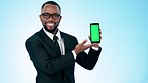 Happy businessman, phone and green screen in marketing or advertising against a studio background. Portrait of black man or business employee showing mobile smartphone app, display or mockup space