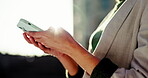 Hands, outdoor and woman with a smartphone, employee and internet with social media, mobile user and contact. Closeup, city or person with digital app, email or network with cellphone or website info