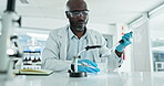 Black man, dropper or scientist in laboratory for liquid particles, medical study or test experiment. Glass, pipette or water with chemical formula for science development on petri dish results 