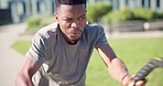 Man, workout or training with ropes for closeup with motivation, determined and expression on face. Black, person and fitness for health in wellness for strength, power and weights for endurance 