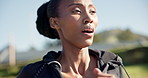 Woman, running and breathing in outdoors, active and workout for health, wellness and goals. Black runner, training and exercise by cardio or jogging in nature, sportswear and endurance for vitality