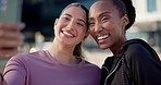 Happy woman, friends and city for selfie, photography or outdoor memory together in fitness. Interracial people smile for photograph, picture or social media in urban town after workout or exercise