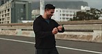 Running, city  and man celebrate with watch for marathon training, exercise and cardio workout. Sports, runner and happy person in road check time for performance speed, fitness goals and wellness