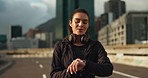 Headphones, calm and woman athlete in city for race, marathon or competition training. Breathe, sports and young female runner listen to music or podcast on break for running cardio workout in town.