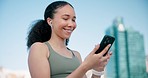 Phone, sports and woman networking in the city for race, marathon or competition training. Technology, smile and young female athlete runner scroll on social media with cellphone for fitness in town.