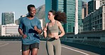 Fitness, talking or couple in city running on road for exercise, training or outdoor workout together. Happy, runners or healthy athletes on street for sports endurance, wellness or cardio challenge