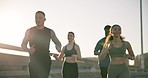 People, fitness and running in city for workout, outdoor exercise or training together in urban town. Group of active runners or athlete in sprint, cardio or sports for marathon, race or practice