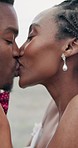 Kiss, wedding and black couple with love, marriage and smile with commitment, romance and bonding. African people, happy bride and groom with happiness, care and trust with celebration and romantic