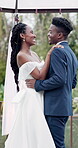 Outdoor, dance and black couple with marriage, wedding and happiness with commitment, event and celebration. African man, woman and embrace outside, love or happy bride with groom, moving and smile