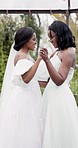 Wedding, dance and a happy African lesbian couple bonding with love and fun in marriage. Smile, together and black woman or lgbt people holding hands with romance, commitment and care in relationship