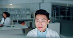 Scientist, man and computer for laboratory research, data analysis and reading medical results or test report. Doctor, science expert or asian person working on desktop for healthcare review at night