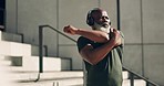 Black man on stairs for exercise, stretching with headphones and muscle workout for morning body training. Urban fitness, power and performance, athlete on steps with music, warm up and outdoor sport