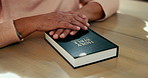 Hands, Bible and person worship for religion, study scripture with trust in God and reading story. Prayer, faith and spiritual closeup with holy book, learn Christian literature and gospel at home