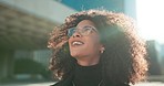 Face, vision and wind with a business black woman in the city for growth, opportunity or inspiration. Thinking, street and smile with a happy young employee looking around an urban town for ideas