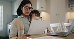 Mother, baby and documents for work from home budget, financial paperwork and receipt or bills on computer. Single mom on laptop with mortgage invoice, rent or planning with child care in her kitchen