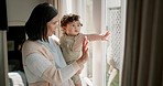 Window, home and mother wave with baby looking at garden view for bonding, love and relaxing. Family, glass and happy mom with child pointing outdoors for connection, development and childhood